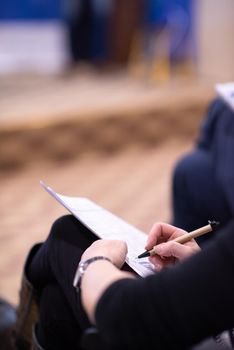 young people taking notes on education training  business seminar at modern conference room