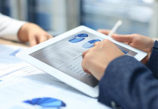 Business woman working with a digital tablet at modern office