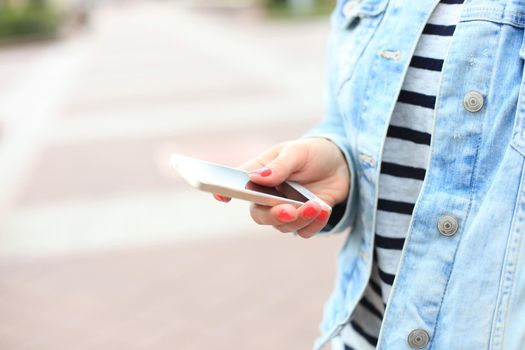 Close up of a woman using mobile smart phone