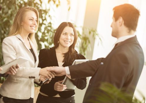 Conference of entrepreneurs. Deals with a handshake in the office