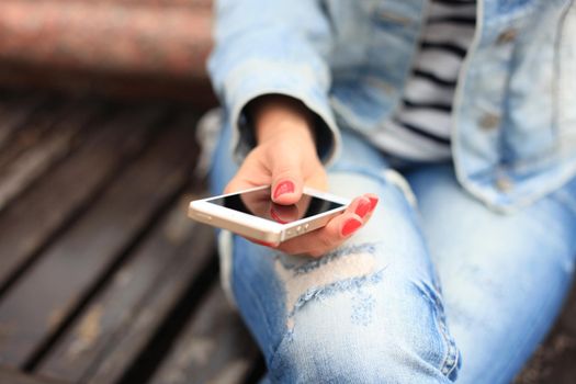 Close up of a woman using mobile smart phone