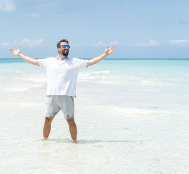 One man is enjoying beautiful tropical beach