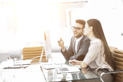 members of the business teams work with the data on the laptop on workplace in the office.the photo has a empty space for your text