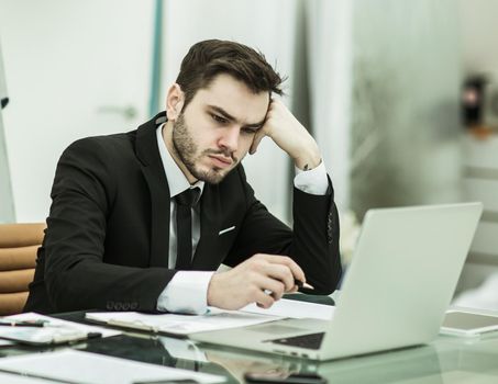 businessman working with financial documents at Desk in modern office