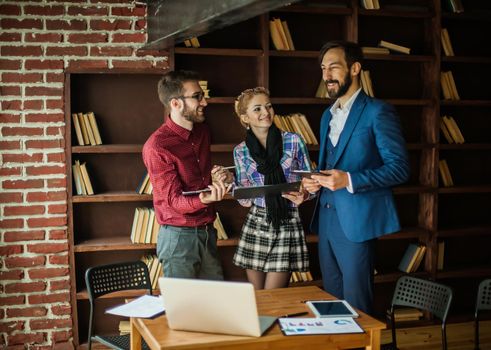 successful business team discussing the plan of work at the workplace in a modern office.the photo has a empty space for your text