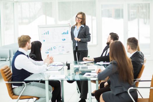 business team gives a presentation of a new financial project for the business partners of the company . the photo has a empty space for your text.