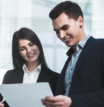 young employees talk standing in the office. teamwork