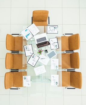 top view - financial charts,marketing charts,notebooks and pens at the work place in an empty office .the photo is a blank space for your text