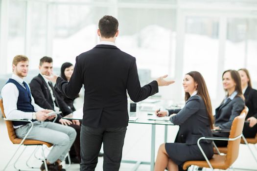 CEO speaks at the workshop business team in a modern office. the photo has a empty space for your text.