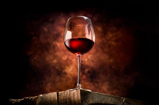 Wine in a glass on a wooden table