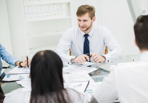 business team discussing a new contract at the workplace in the office.the photo has a empty space for your text