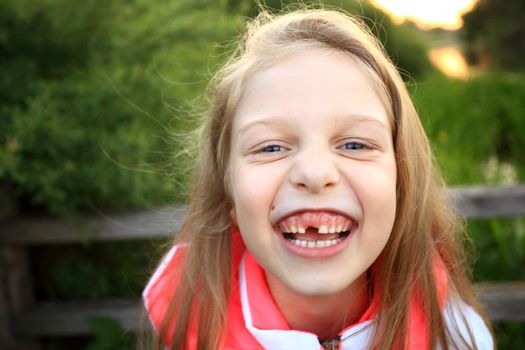 smiling little girl in a Park in autumn day