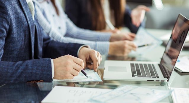 closeup of business team is working with financial documents at workplace in the office.