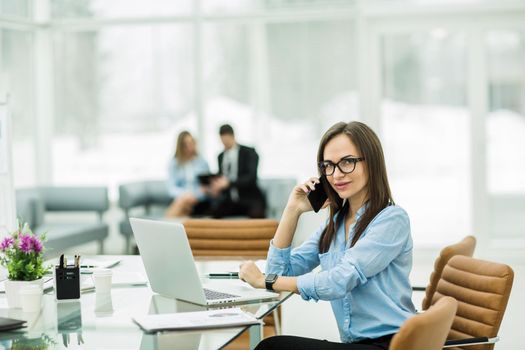 Manager Finance in the workplace in a modern office.the photo has a empty space for your text