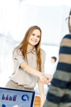 closeup - the lawyer and the client, shake hands after signing the financing contract.the photo has a empty space for your text.