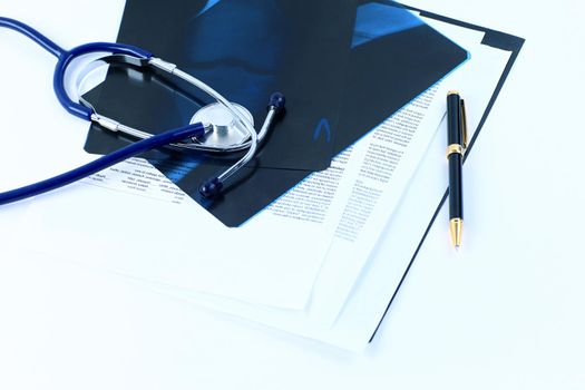 Medical documents of fluorography with pen and stethoscope on the table