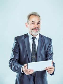 successful businessman with digital tablet on light background.the photo has a empty space for your text