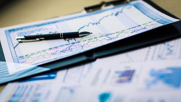 Drawings and charts of successful business, workplace of the businessman