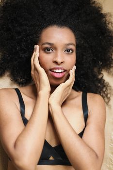 Portrait of black woman wearing underwear. Concept of afro american beauty and female person.