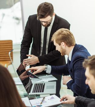 successful business team discussing a new financial plan of the company in the workplace in the office