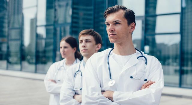 close up. team of doctors standing on a city street. photo with a copy-space.