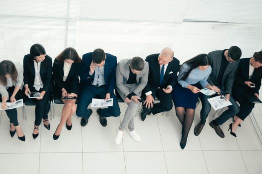 top view. young employees discussing financial data. photo with a copy of the space