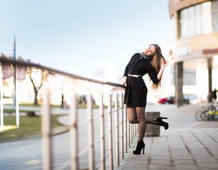 Female manager on the background of an office building. Photo has empty space for your text