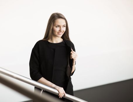 successful business woman on a light office background. Photo has empty space for your text
