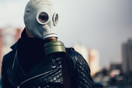 close up. casual guy in a gas mask . photo with a copy-space