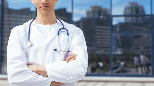 close up. ambulance doctor standing on a city street. photo with a copy-space.