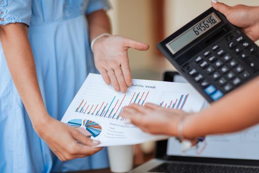 close up. business woman discussing a financial chart with colleague. business concept.