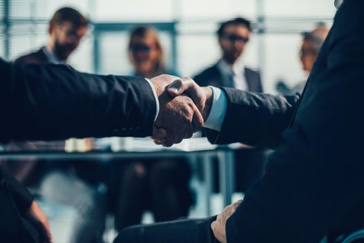 business partners shaking hands during a business meeting. the concept of cooperation