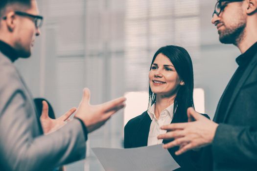 smiling business partners shaking hands with each other. the concept of cooperation