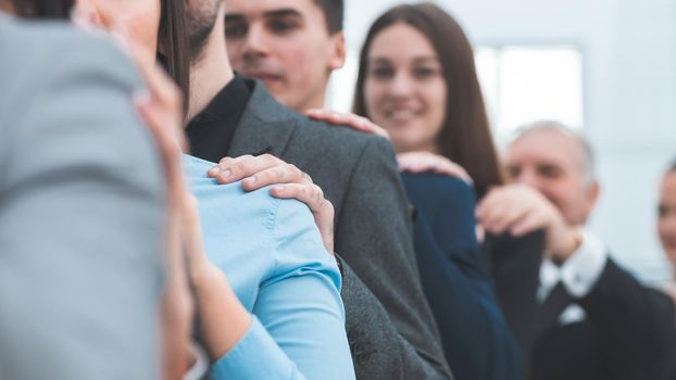 close up. a group of young professionals supporting each other. the concept of teamwork