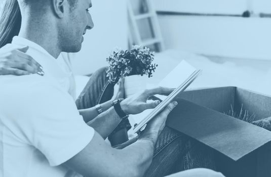 close up. young couple sitting on the floor in a new apartment.