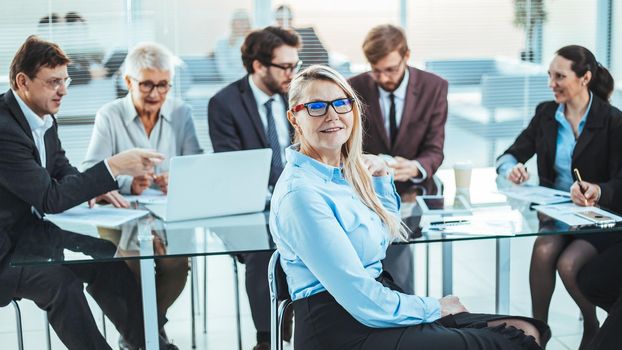 Mature business woman at a meeting of the working group. business people