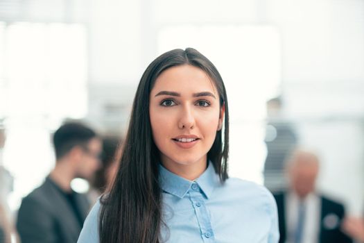 close up. female consultant against the background of a modern office. work with documents