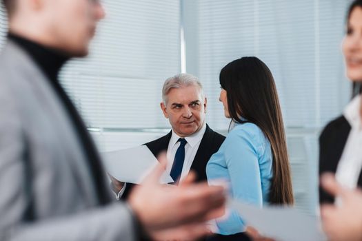 smiling business partners shaking hands with each other. the concept of cooperation