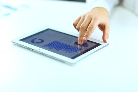 Businessman with finger touching screen of a digital tablet
