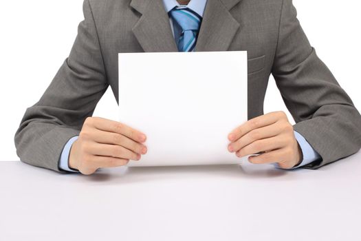 handsome businessman holding a whiteboard and pointing, looking at the camera and smiling, isolated on white, studio shot