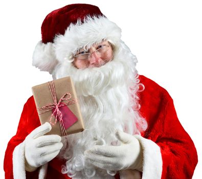Santa Claus holding a plain brown wrapped package. The eco friendly recyclable gift is tied with string and has a blank gift tag. Over White.