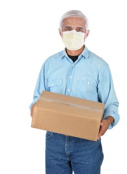 Package deliveryman wearing protective covid-19 mask with a single parcel isolated over white.