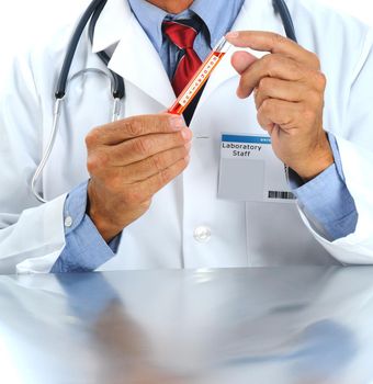 Laboratory technician holding a test tube with the word coronavirus, an epidenic originating in Wuhan, China. 