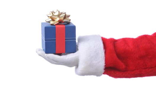 Closeup of Santa Claus holding a small Christmas present on his outstretched hand.. Hand and arm only isolated on a white background. The present is wrapped and tied with a red ribbon and gold bow.