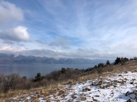 Winter landscape with snow and Lake Sevan is the largest body of water in Armenia and the Caucasus region