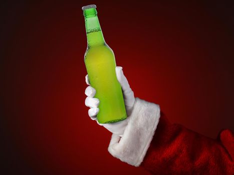 Closeup of Santa Claus holding a Green Bottle of Beer Over a Red Background. Horizontal format .