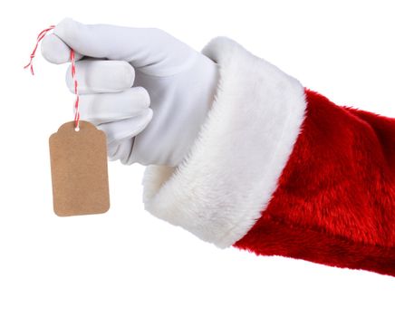 Closeup of Santa Claus hand holding a blank gift tag over a white background. Only Santa's white gloved hand red suit are shown.