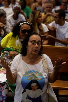 salvador, bahia, brazil - october 13, 2019: Devotees of Santa Dulce of the Poor are seen during mass at the Santa Sanctuary in the city of Salvador.