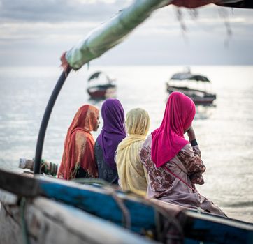 Group of Muslim girls together on the beach