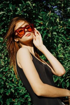 pretty woman wearing sunglasses summer nature posing. High quality photo